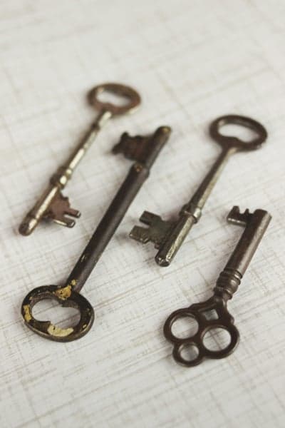 Antique Skeleton Keys on Textured White Background