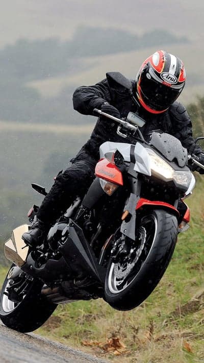 Sportbike Rider Leaning on Rainy Road Phone Wallpaper