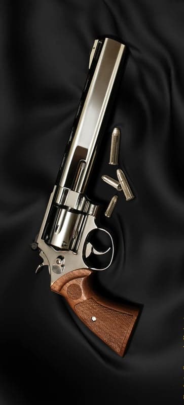 Polished Revolver and Cartridges on Black Silk