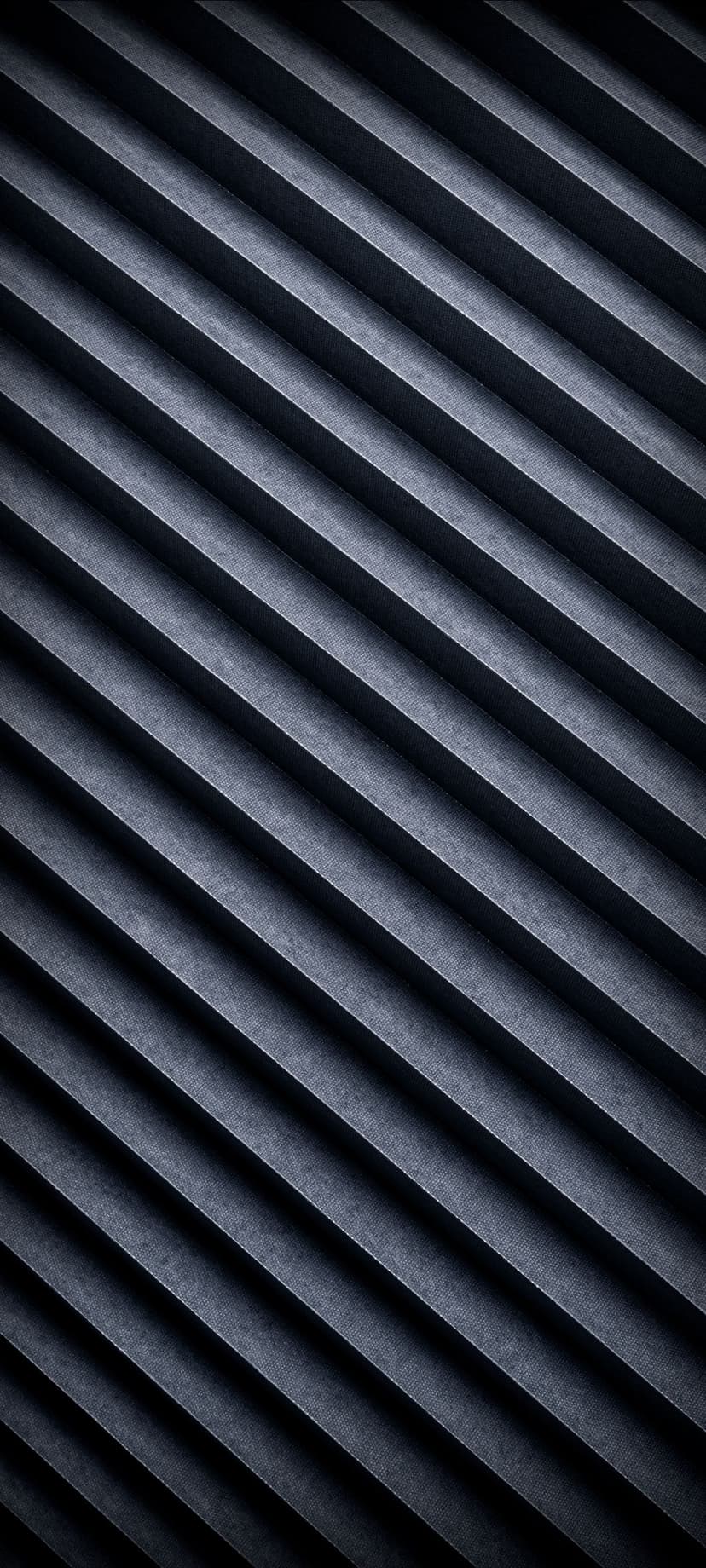 Dark blue pleated folds with diagonal shadows and light highlights create a textured geometric surface pattern.