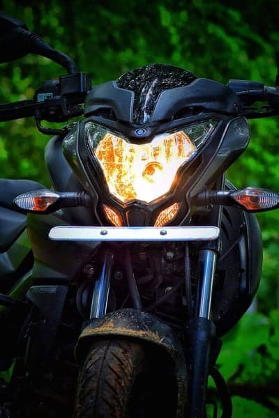 Front view of a Bajaj Pulsar NS200 motorcycle headlight
