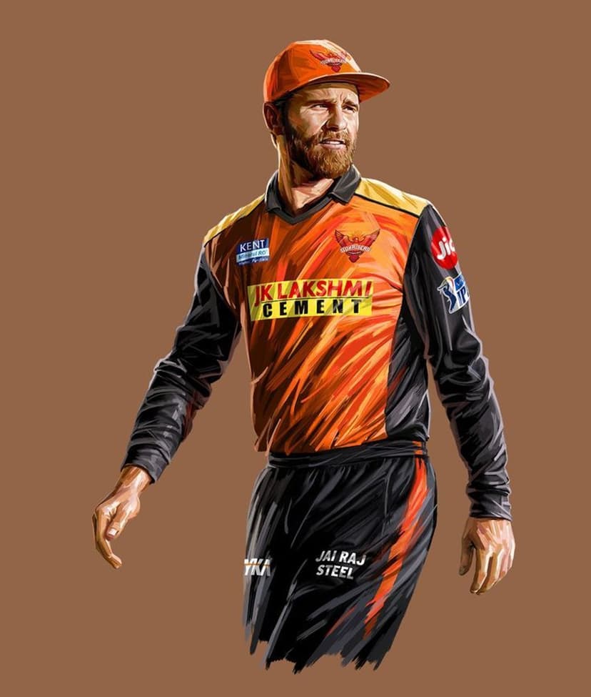 Kane Williamson wearing an orange SRH jersey and cap against a brown background with a calm facial expression.