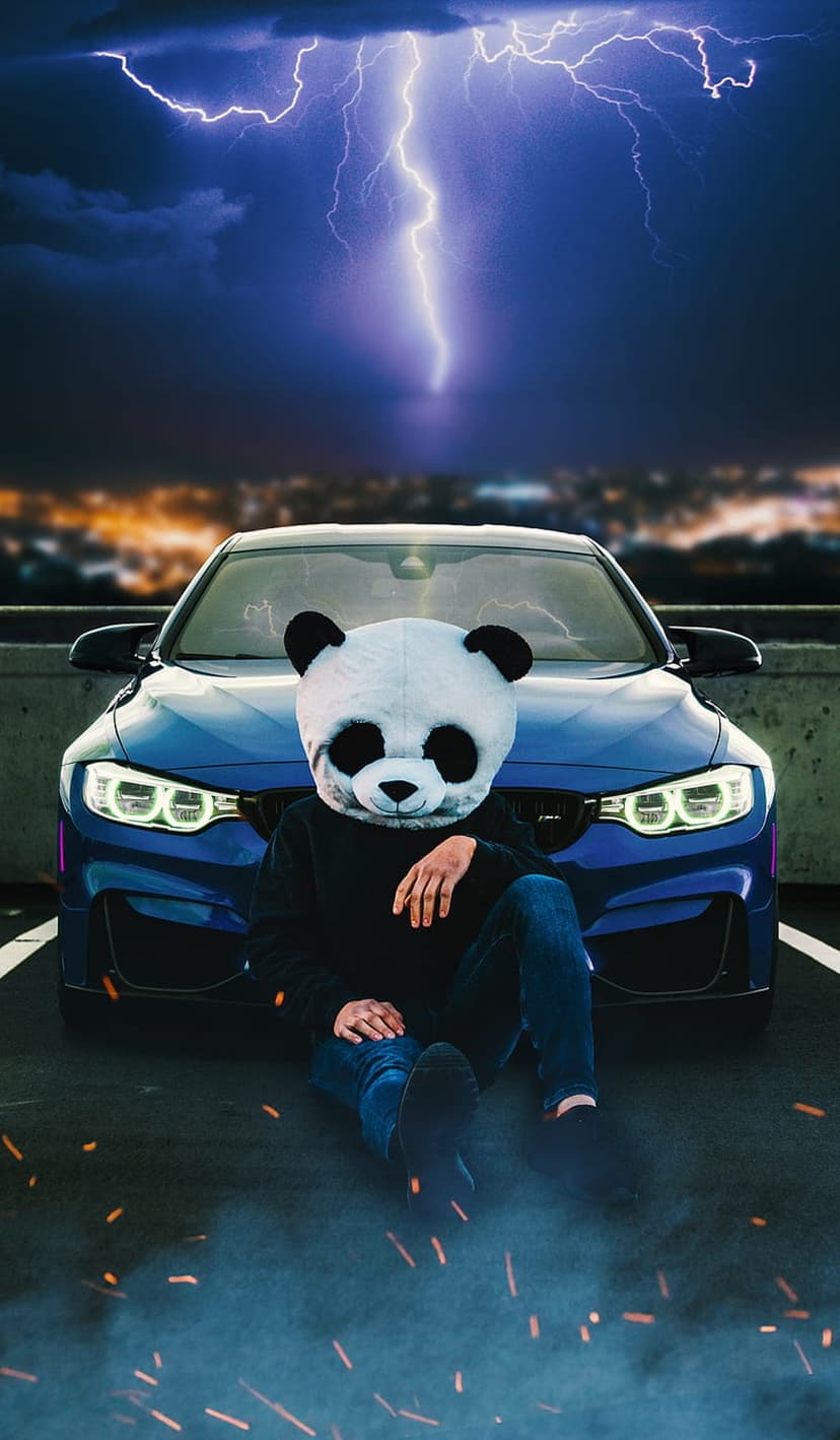 Person in a panda mask sits on the ground by a blue sports car under a stormy sky with a bright lightning strike.