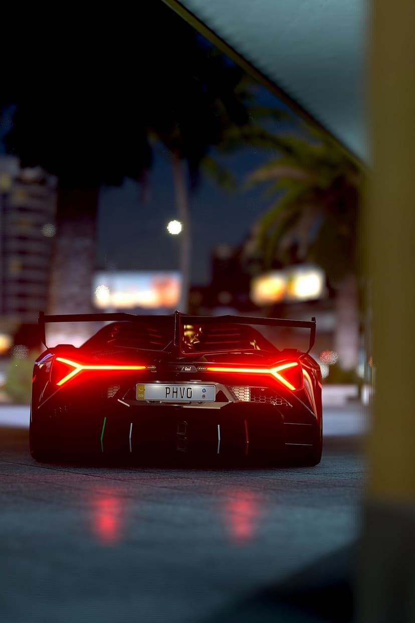 Black sports car with glowing red taillights parked on a city street at night under tropical palm trees.