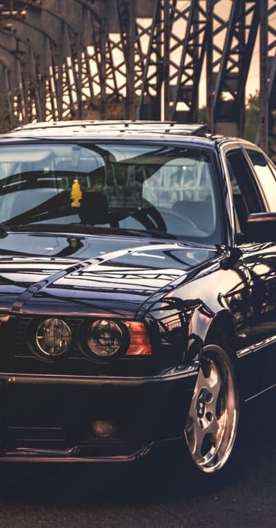 Classic Black BMW E34 M5 on a Bridge
