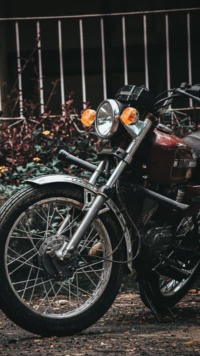 Vintage Red Yamaha Motorcycle Front Wheel and Handlebars