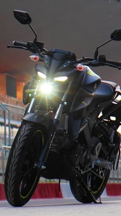 Yamaha MT-15 Motorcycle Front View with Bright Headlights