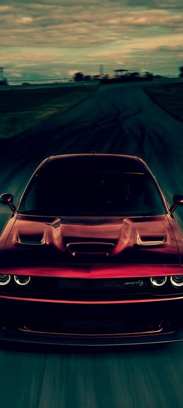 Red Dodge Challenger SRT Driving Fast on Road