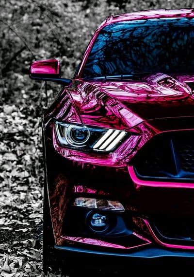 Vibrant Pink Ford Mustang with Reflective Chrome Finish