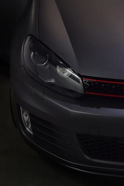 Matte Grey Volkswagen GTI Headlight and Grille Close-up