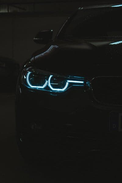 Midnight BMW Front View with Glowing Blue LED Headlights