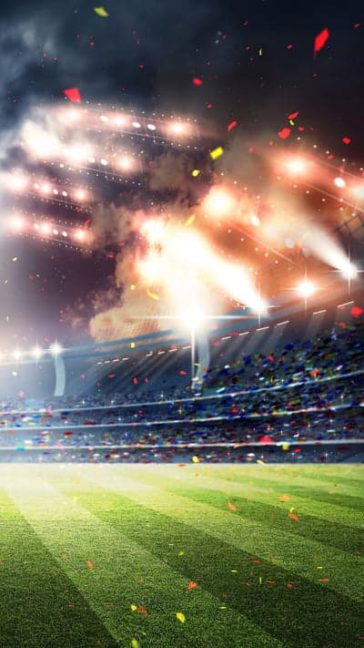 Soccer stadium with confetti and bright stadium lights