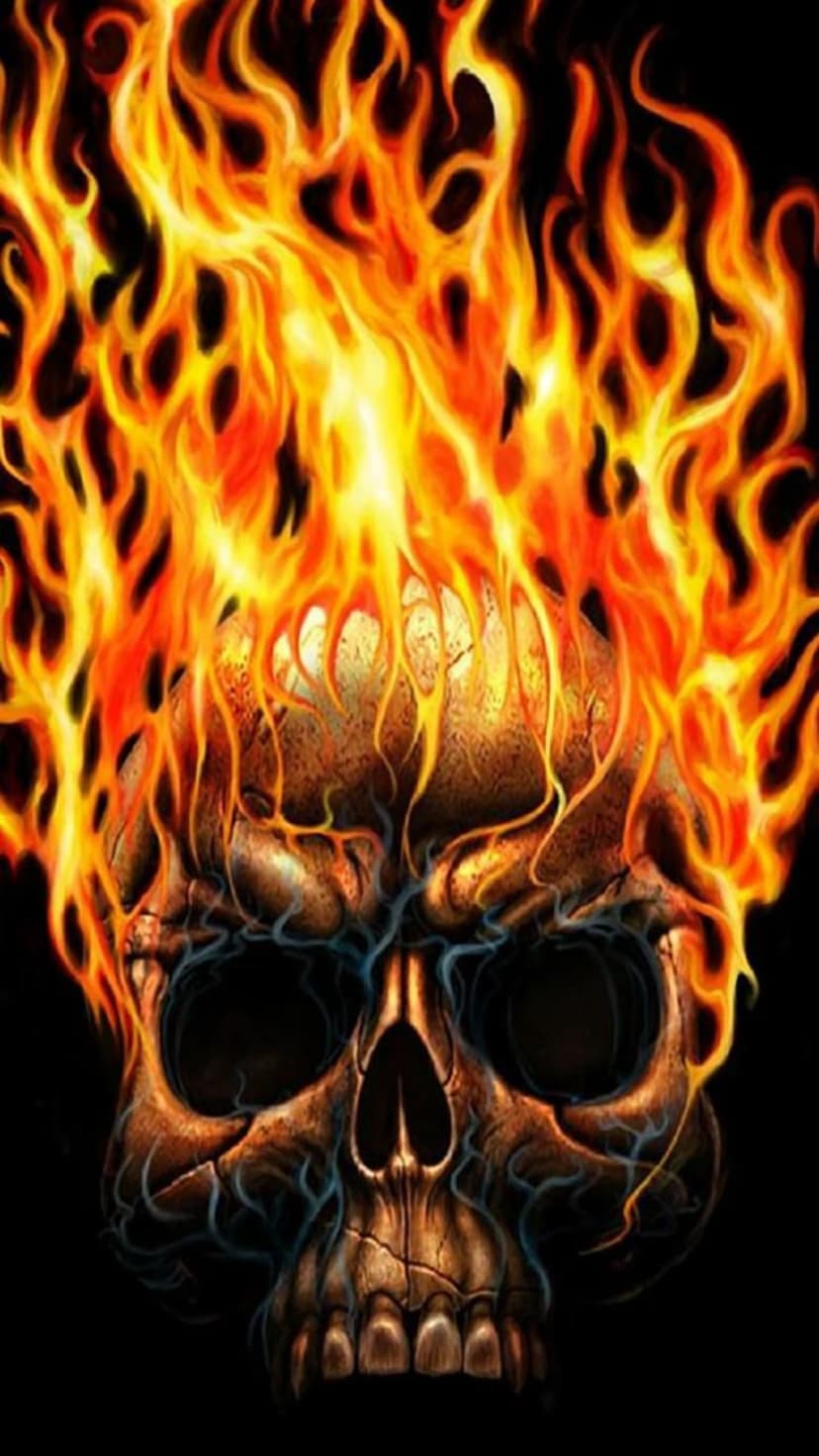 Human skull engulfed in orange flames and wispy blue smoke against a solid black backdrop for high contrast.