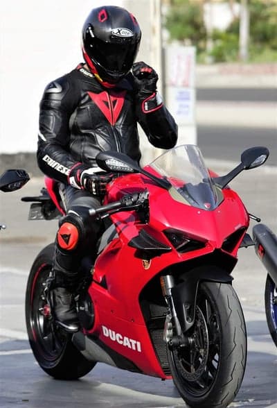 Red Ducati Superbike and Rider Dainese Gear Phone Wallpaper