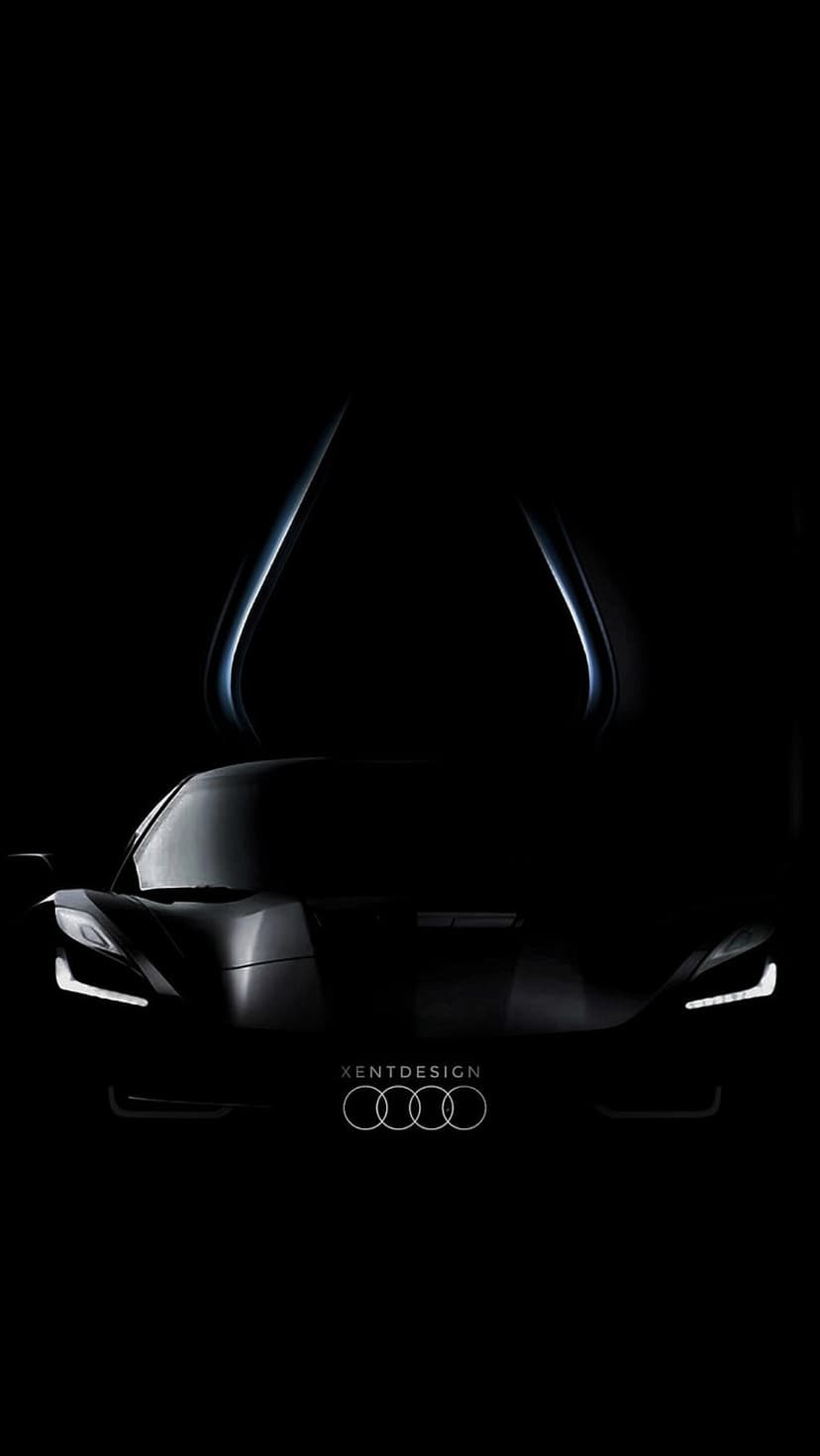 Audi concept car with open butterfly doors sits in darkness, featuring sharp lines and a glowing front logo.