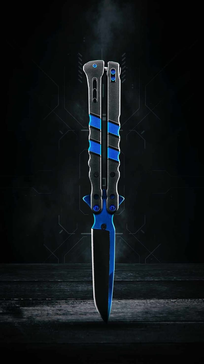 Blue butterfly knife with textured black handles on a smoky dark background with faint geometric patterns.