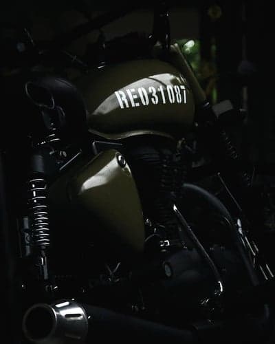 Classic Olive Green Motorcycle with 'RE031087' Decal