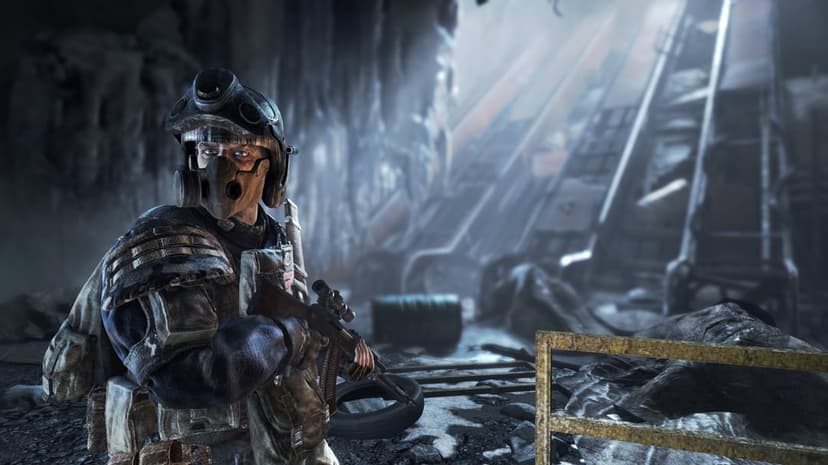 Soldier in gas mask and combat gear holding a rifle inside a ruined post-apocalyptic underground tunnel.