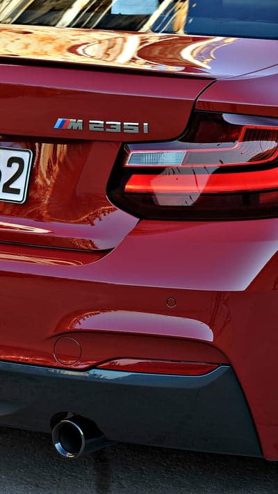 Red BMW M235i Rear Detail with Exhaust and Tail Light