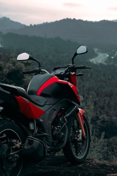 Red and Black Motorcycle on a Scenic Mountain Overlook