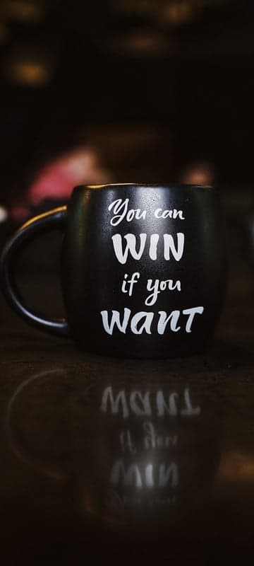 Black mug with inspirational quote "You can WIN if you want"