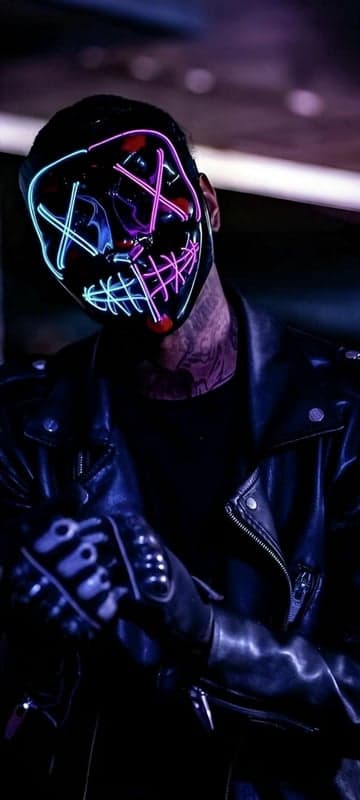 Man in Neon Purge Mask and Leather Jacket