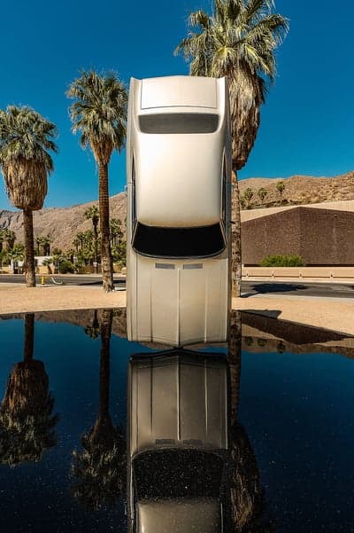 Artistic Car Sculpture and Palms Desert Phone Wallpaper