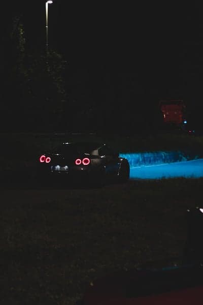 Midnight Supercar Tail Light Glow Mobile Background