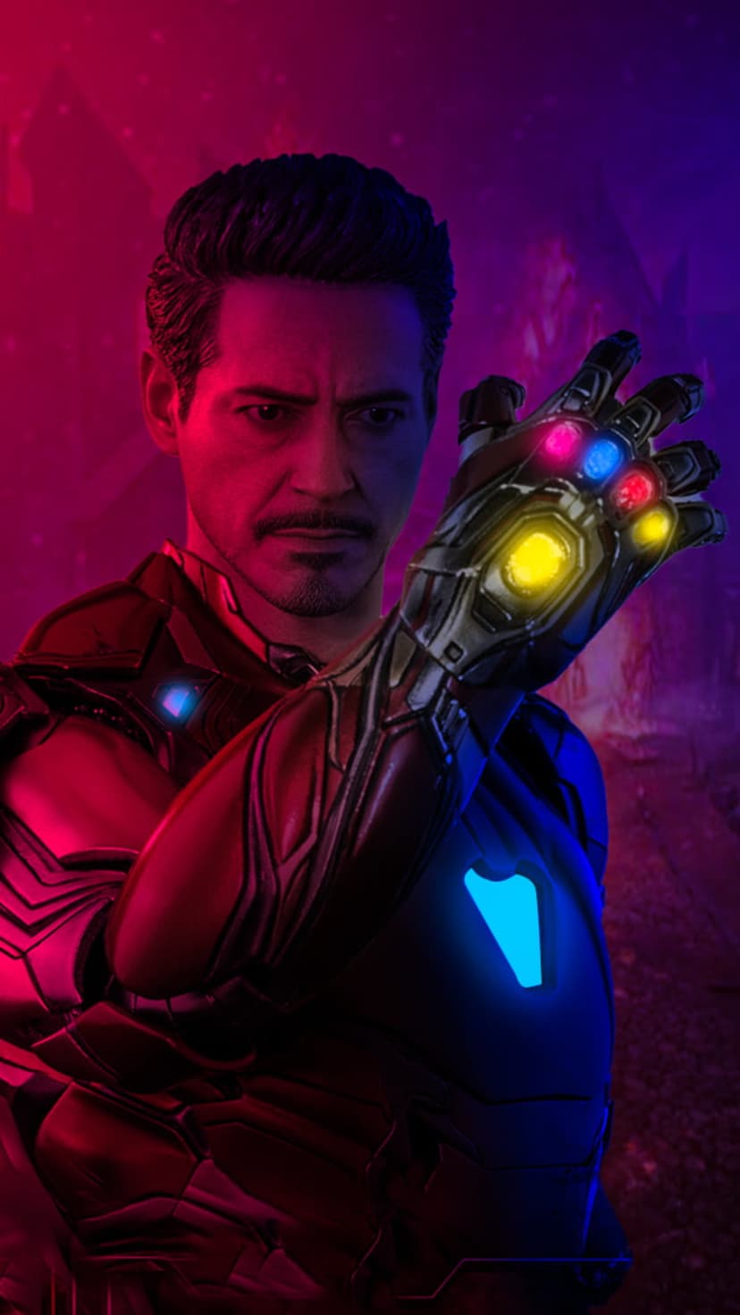 Iron Man in red armor holds the Infinity Gauntlet with six glowing stones against a pink and purple backdrop.