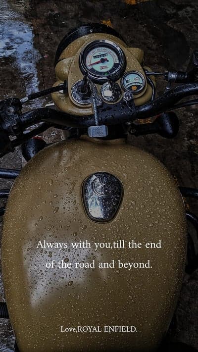 Rainy Day Royal Enfield Motorcycle with Inspiring Quote