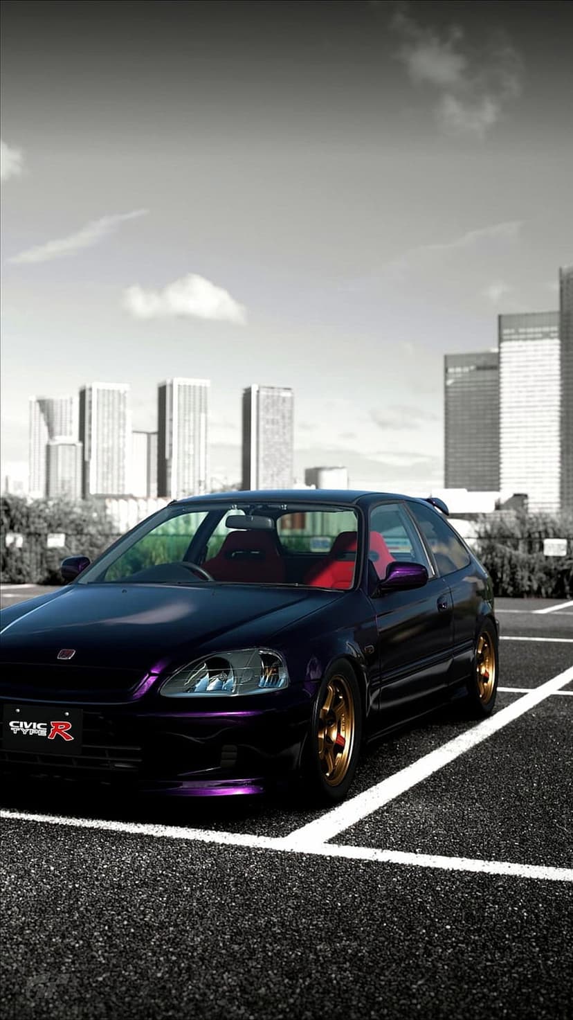 Purple Honda Civic Type R featuring gold rims and racing seats parked on a gray city street under a cloudy sky.
