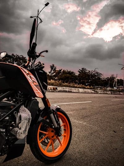 KTM Motorcycle on a Cloudy Road