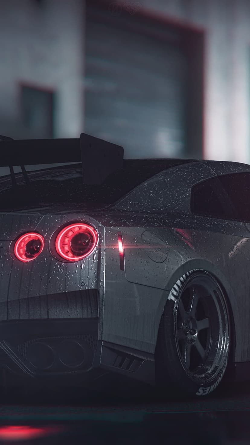 Nissan GT-R circular red tail lights glow on a wet car body with rain droplets during a dark night.