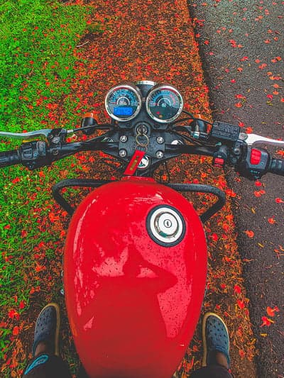 Riding a Red Motorcycle on a Rainy Day