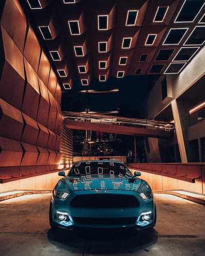 Teal Ford Mustang Night Architecture Mobile Background