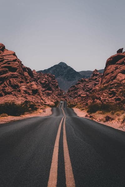 Desert Highway Through Red Rock Formations