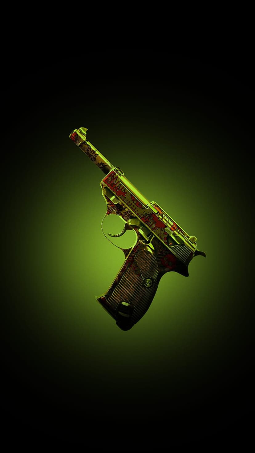 Engraved handgun with red and gold scrollwork rests under a green spotlight against a dark background.