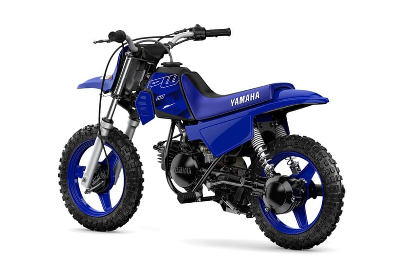 Blue Yamaha PW50 mini dirt bike with knobby tires and silver forks on a clean white background.