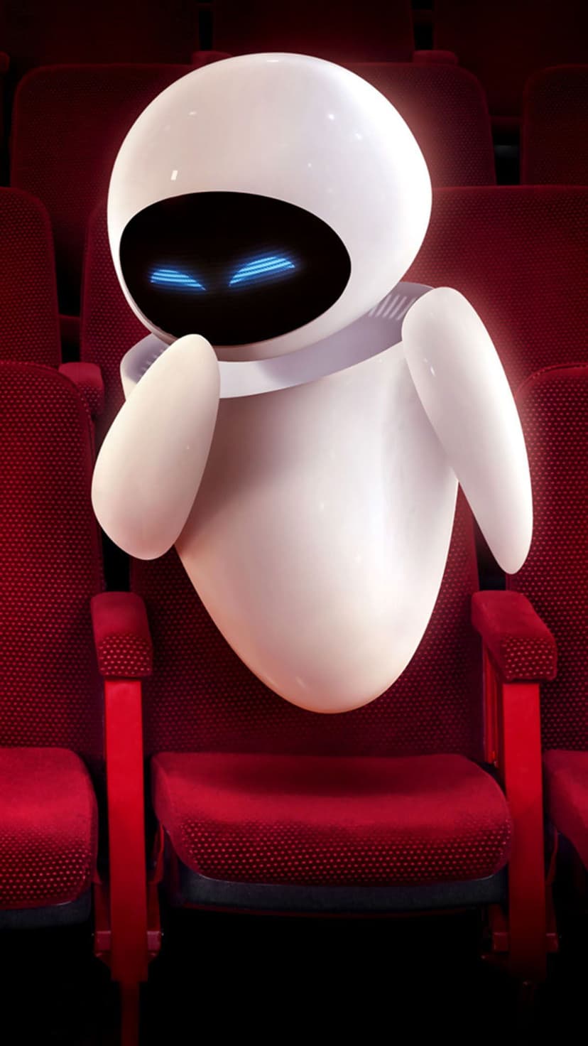 EVE robot with glowing blue eyes sits in a red velvet cinema seat surrounded by empty theater chairs.