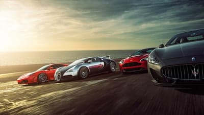 Supercars at Sunset Coastal Road Desktop Wallpaper