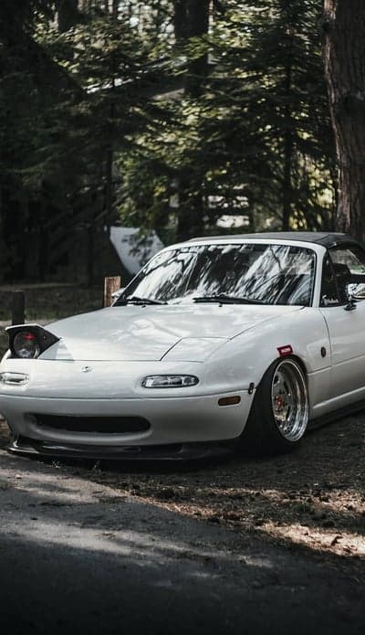 White Mazda Miata JDM Roadster Forest Path Phone Wallpaper