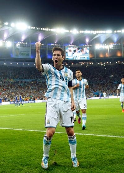 Lionel Messi celebrates scoring for Argentina