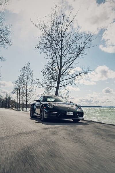 Black Porsche 911 Coastal Drive Mobile Phone Wallpaper
