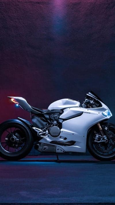 Sleek White Ducati Motorcycle with Neon Lighting