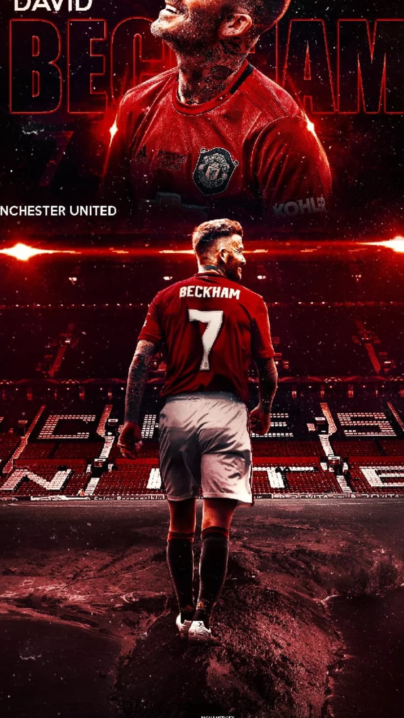 David Beckham wearing his red Manchester United number 7 jersey stands before a blurred, lit football stadium.