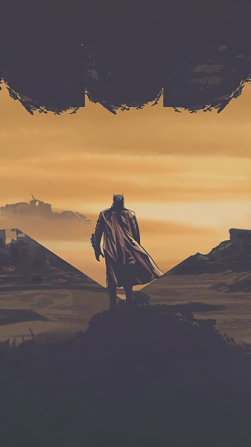 Batman stands on rocks with a flowing cape against a smoky orange sky featuring a hidden bat logo in the clouds.