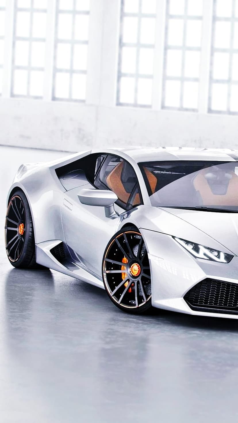White futuristic sports car with orange brake calipers and a tan interior parked on a grey concrete studio floor.