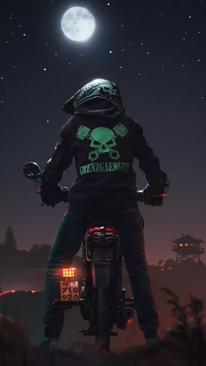 Biker wearing a glowing green skull hoodie sits on a motorcycle under a massive full moon in the night sky.