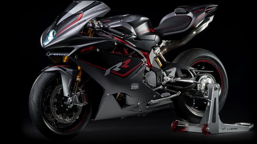 MV Agusta F4 RR motorcycle in matte gray with red accents on a paddock stand against a dark black background.