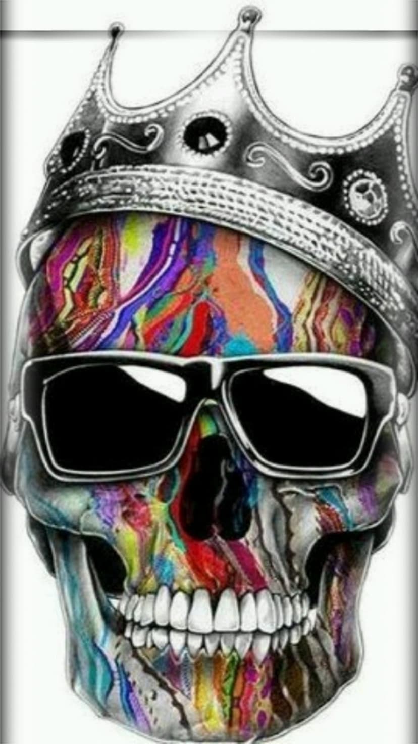 Human skull wearing black sunglasses and a silver crown features multi-colored paint splatters on its surface.